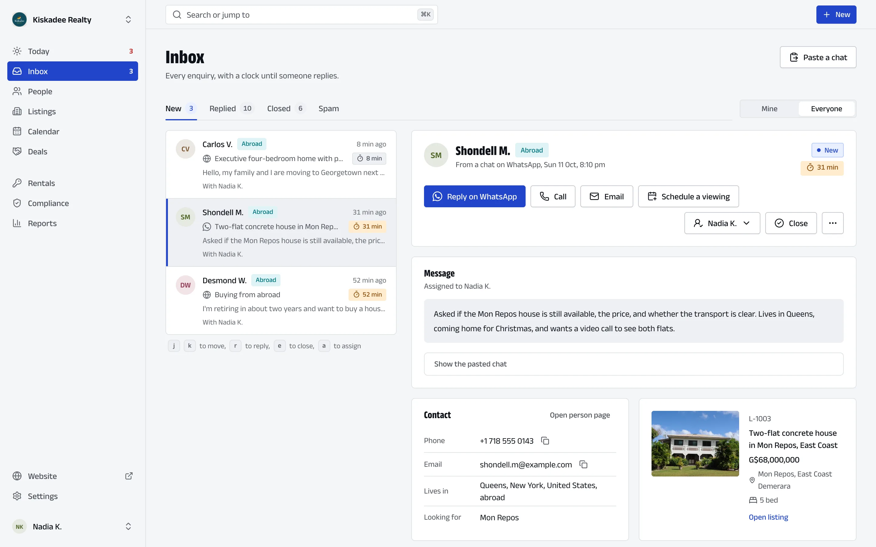 Lotmark on a computer, in the demo agency: the inbox, with three new enquiries from people abroad, each showing how long it has waited for a reply. One is open: a WhatsApp chat asking whether the two-flat house in Mon Repos is still available, its price, and whether the transport is clear, with buttons to reply on WhatsApp, call, email or schedule a viewing, and the house itself at G$68,000,000.